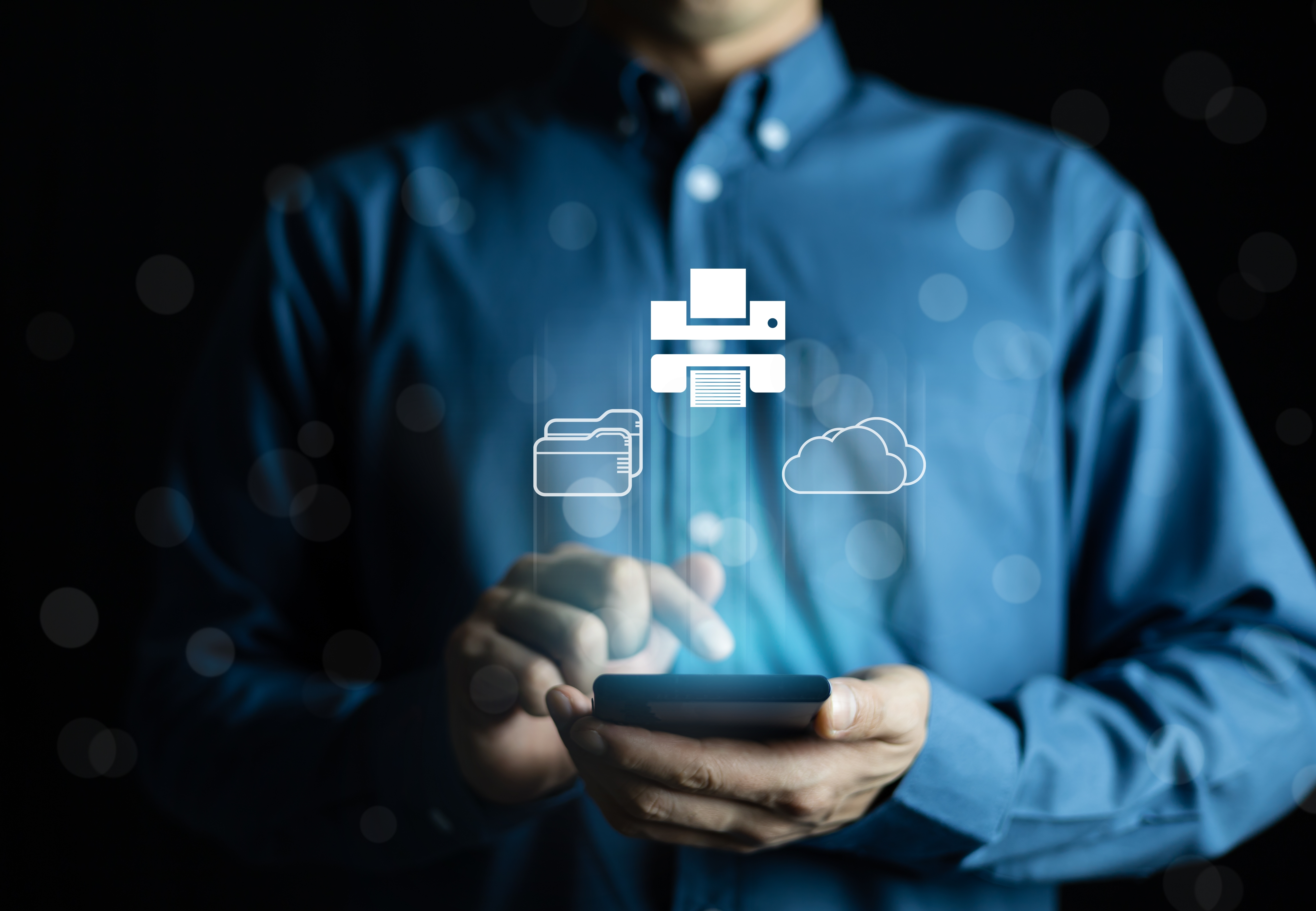 Man uses smartphone to connect to wireless printer.