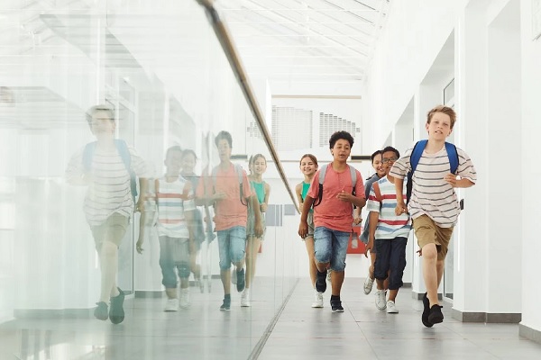 Students running down hallway