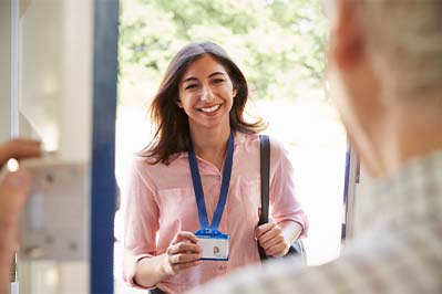 Person entering office reception holding a pass