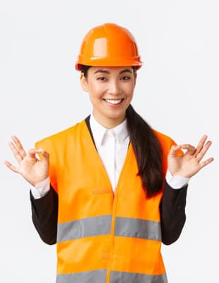 Woman Wearing Hard Hat And High Vis Vest