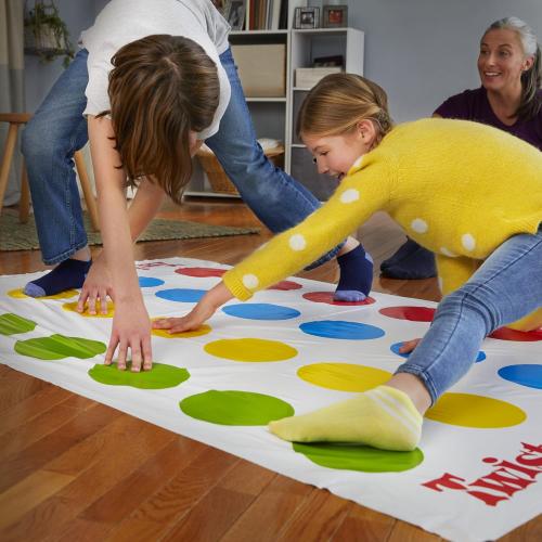 Hasbro Twister Game, Party Game, Classic Board Game for 2 or More Players, Indoor and Outdoor Game for Kids 6 and Up, English and French Bilingual Version - Games - EVEHBG98831024