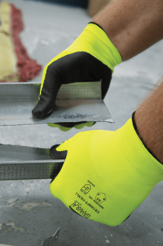 Worker wearing Samurai Glove CR18NFT high-visibility cut-resistant gloves while handling sheet metal