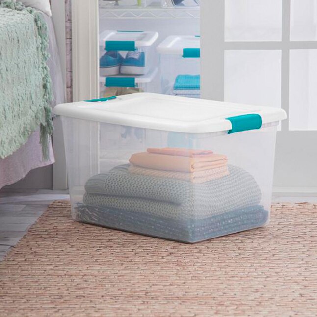 bed clothes in a clear latching tote