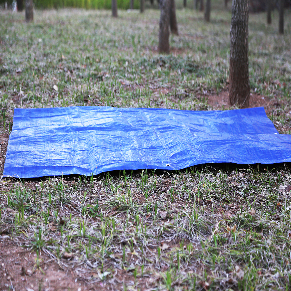 a blue tarp on the ground