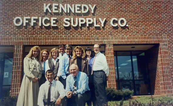 Kennedy team with building — 1990s