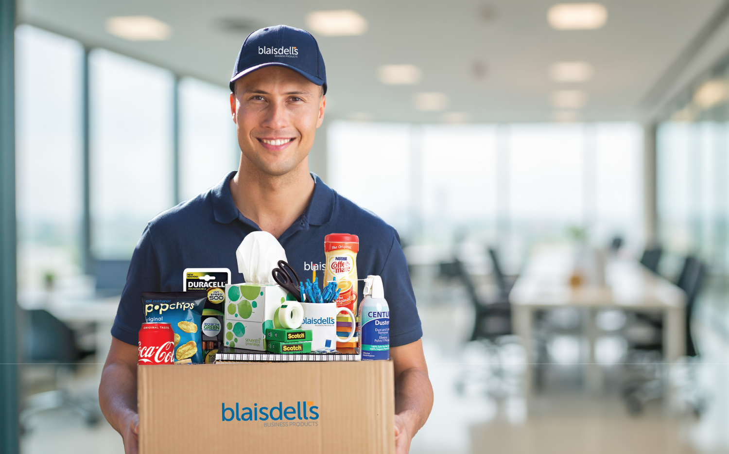 Professional office manager organizing supply orders at desk with computer, calculator, and office supplies, representing streamlined purchasing processes for Bay Area businesses