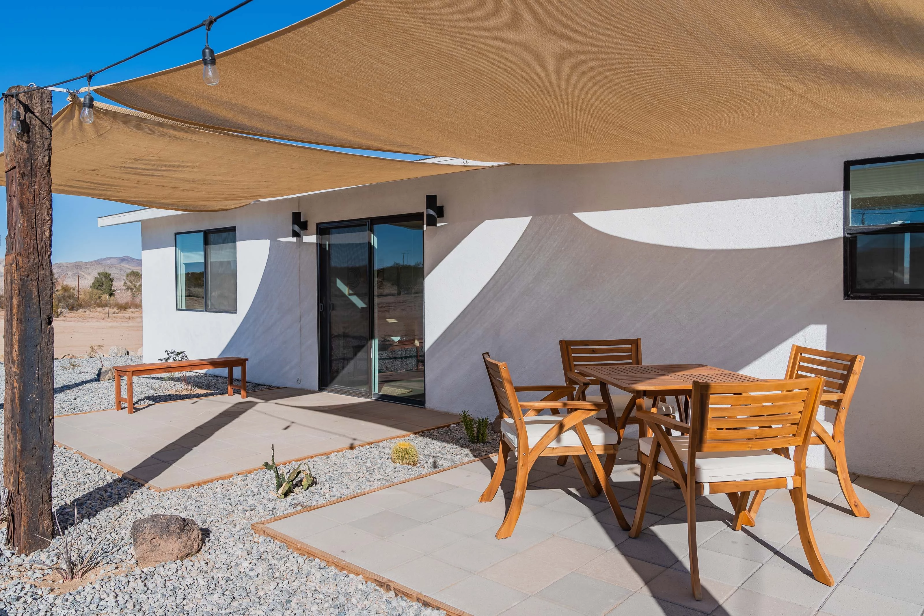 Cozy Outdoor Patio Relaxing patio with wooden furniture under a sunshade