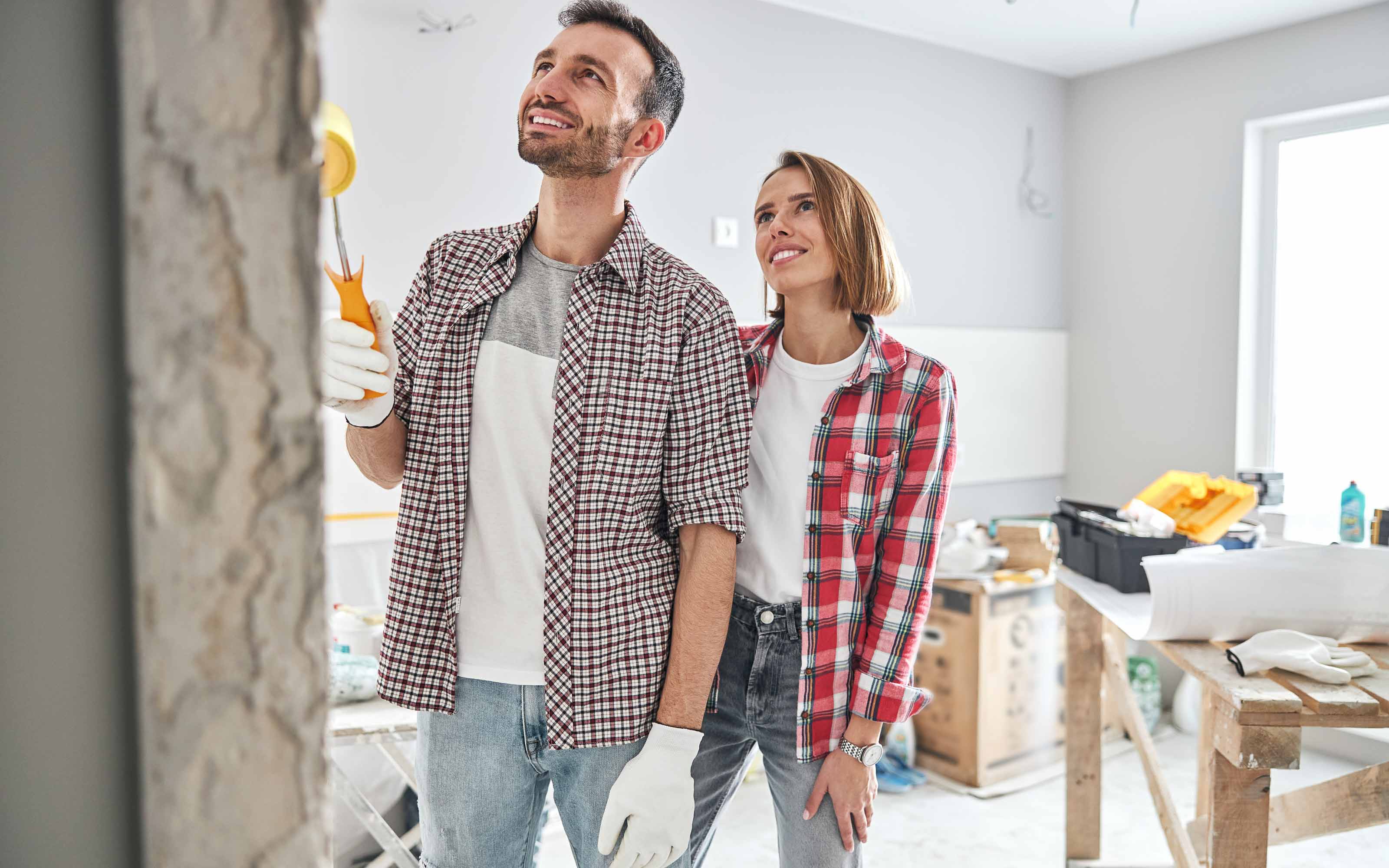 Homeowners planning a home renovation project to improve energy efficiency, comfort, and property value