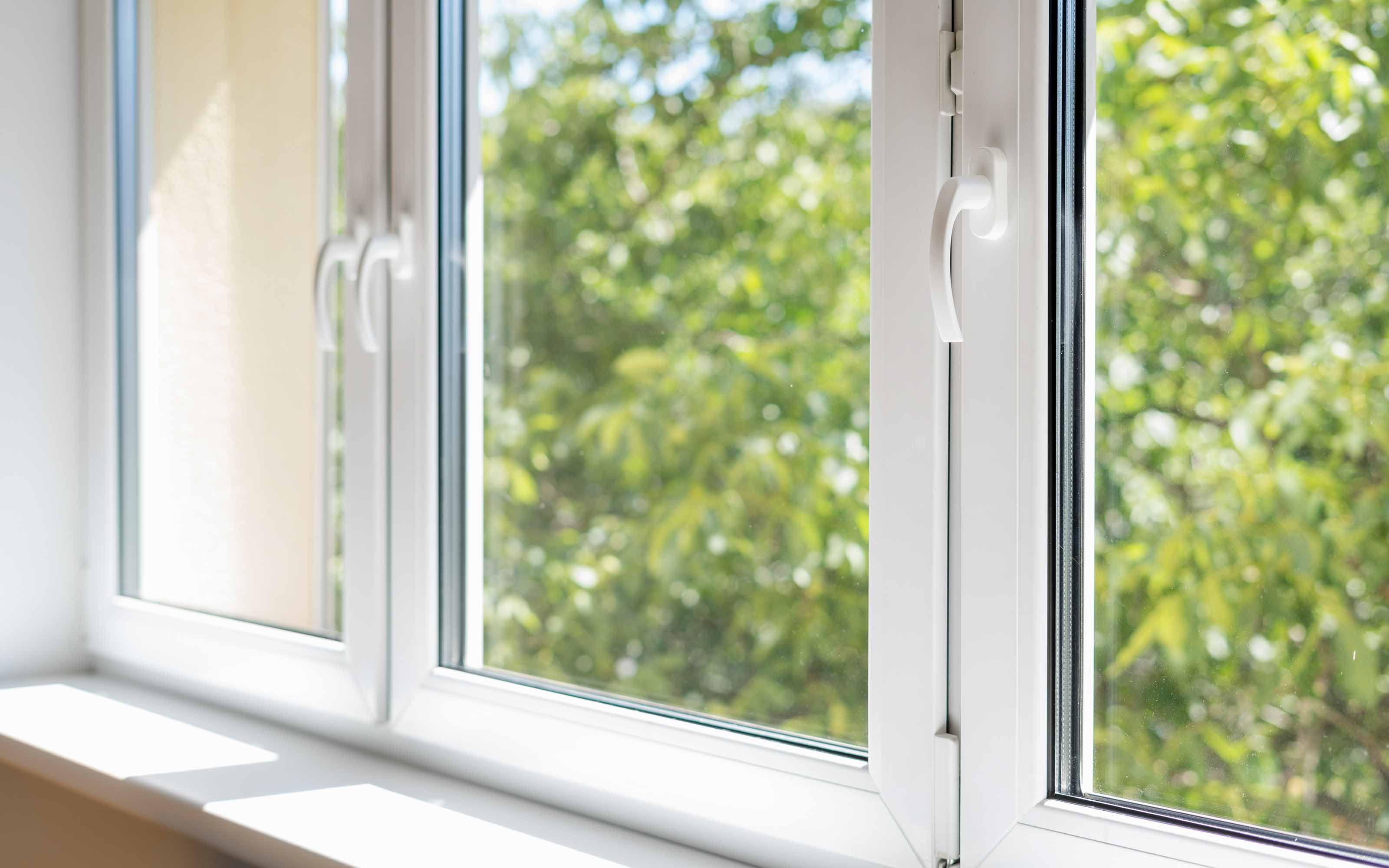 Vinyl replacement window installed in an existing residential window frame