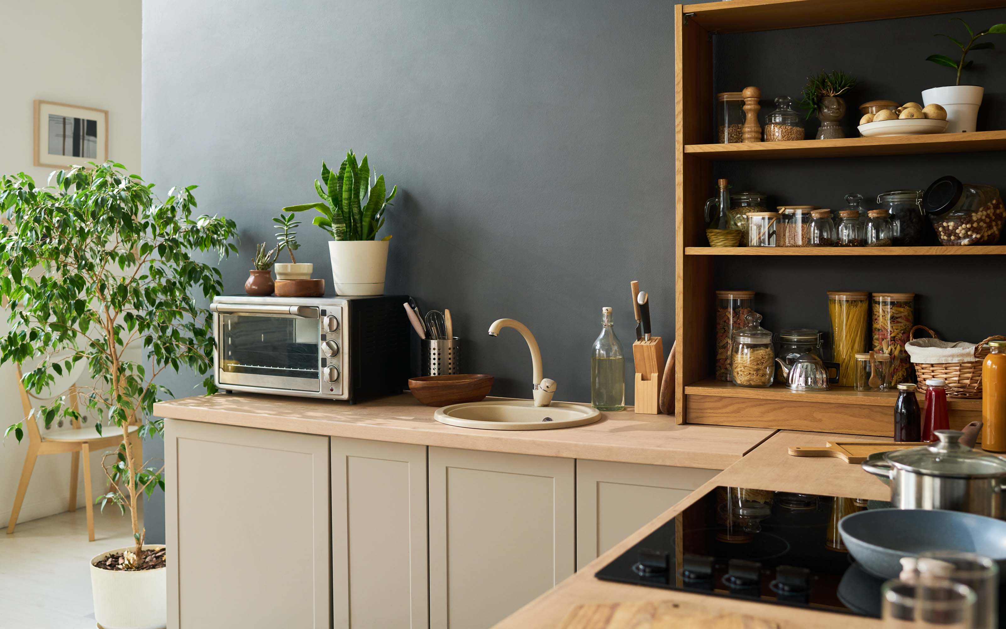 Modern small kitchen with efficient cabinet layout, open shelving, and organized storage design