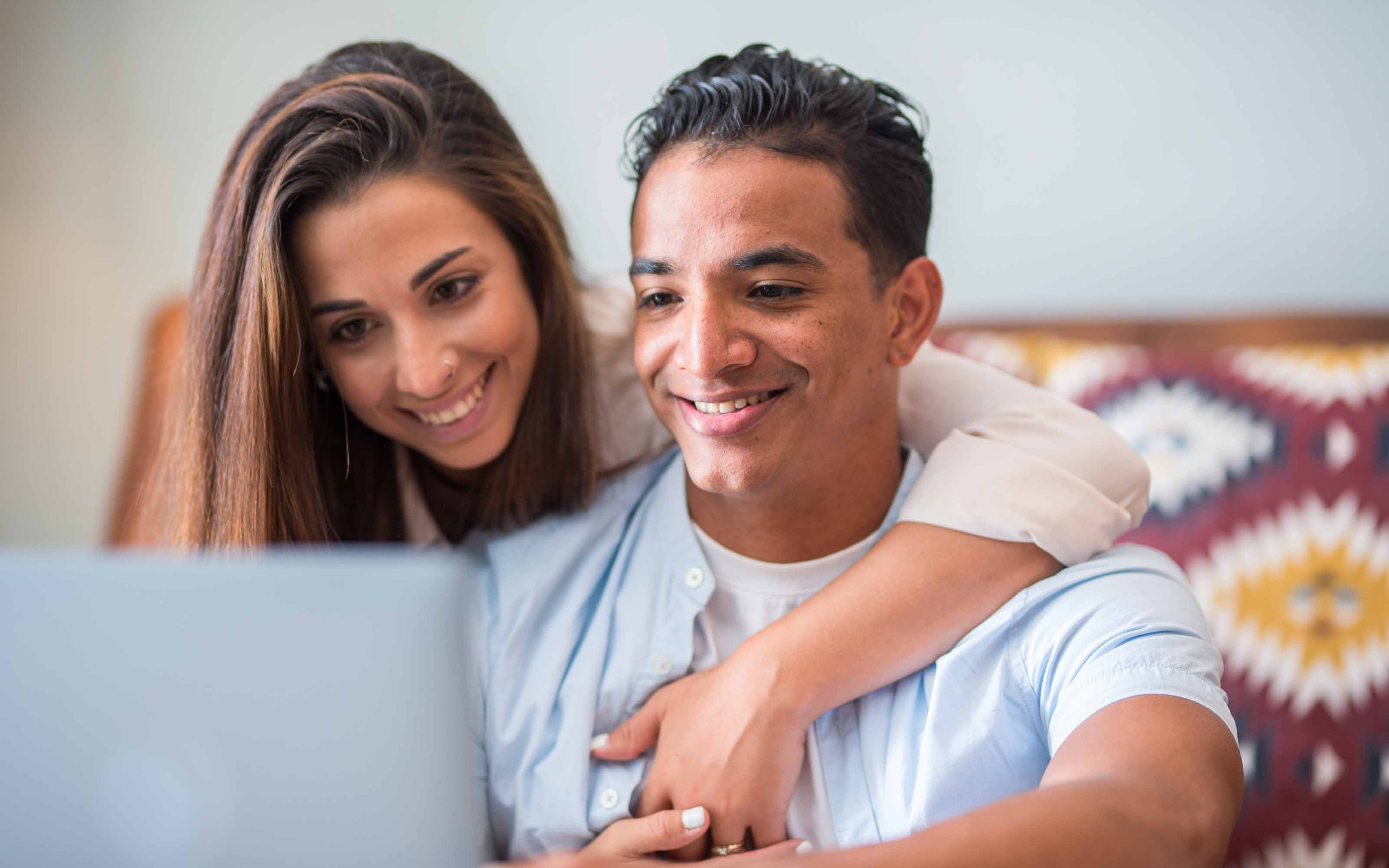 Homeowners researching window rebates, energy-efficiency incentives, and replacement window tax credits online