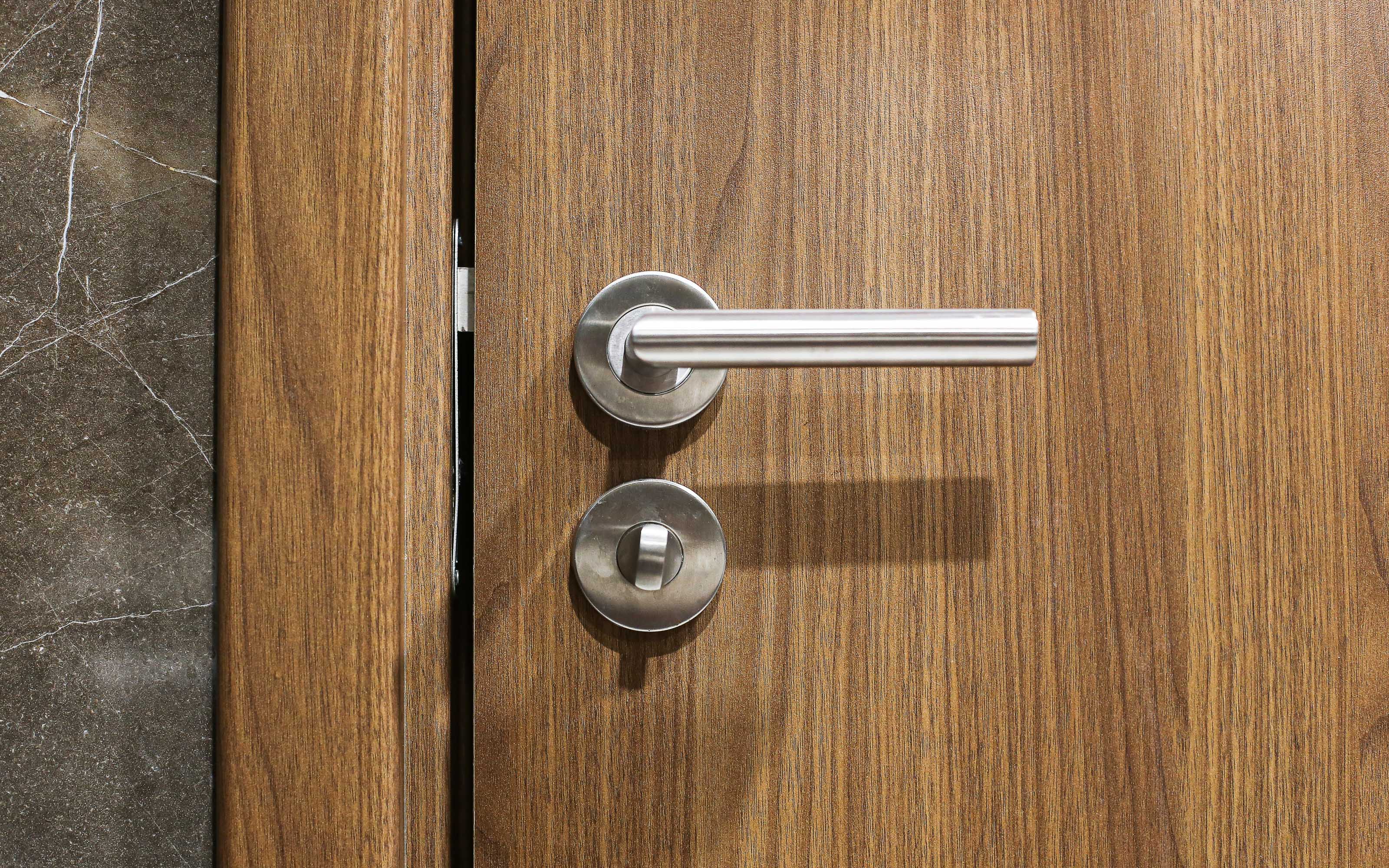 modern wooden entry door handle showing upgraded secure front door design