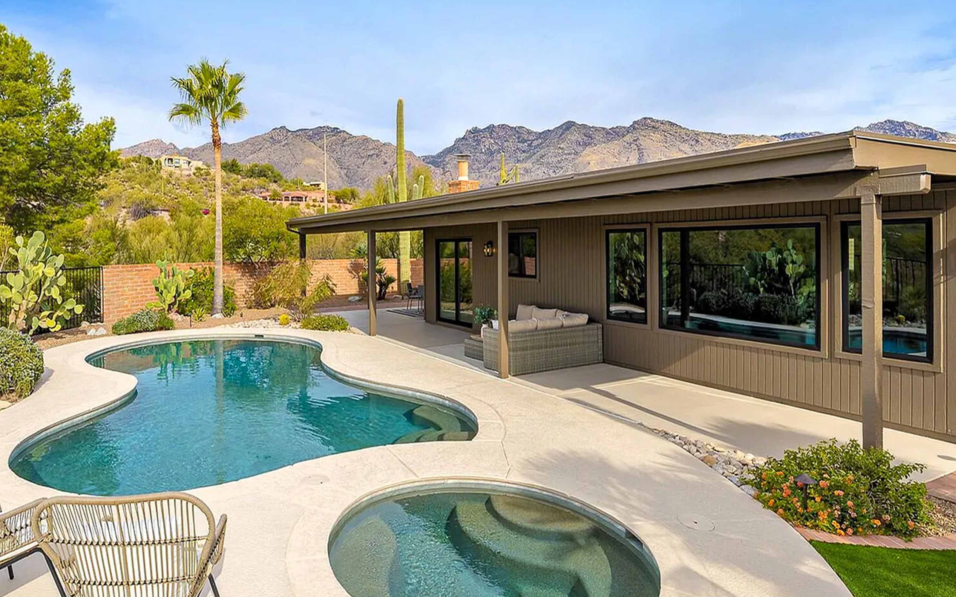 Modern home with black vinyl windows enhancing curb appeal, contemporary style, and energy efficiency