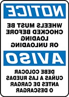 Bilingual OSHA Notice Safety Sign: Wheels Must Be Chocked Before Loading Or Unloading (Backwards)